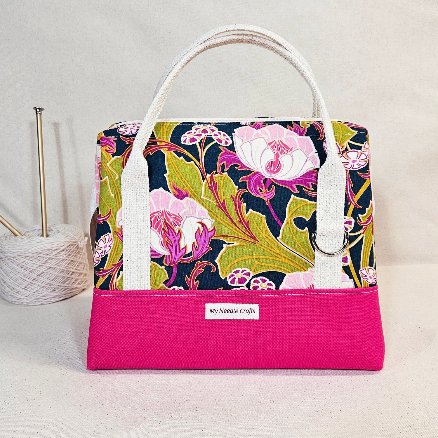 Knit night project bag featuring a floral design, perfect for transporting knitting projects and essentials.